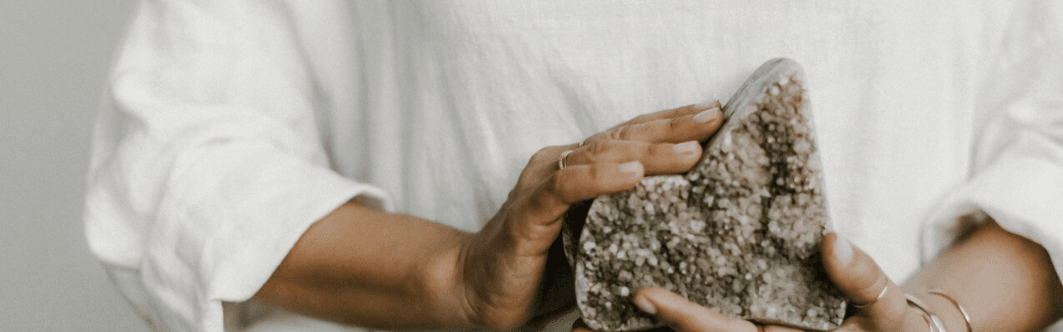 Hands holding crystal